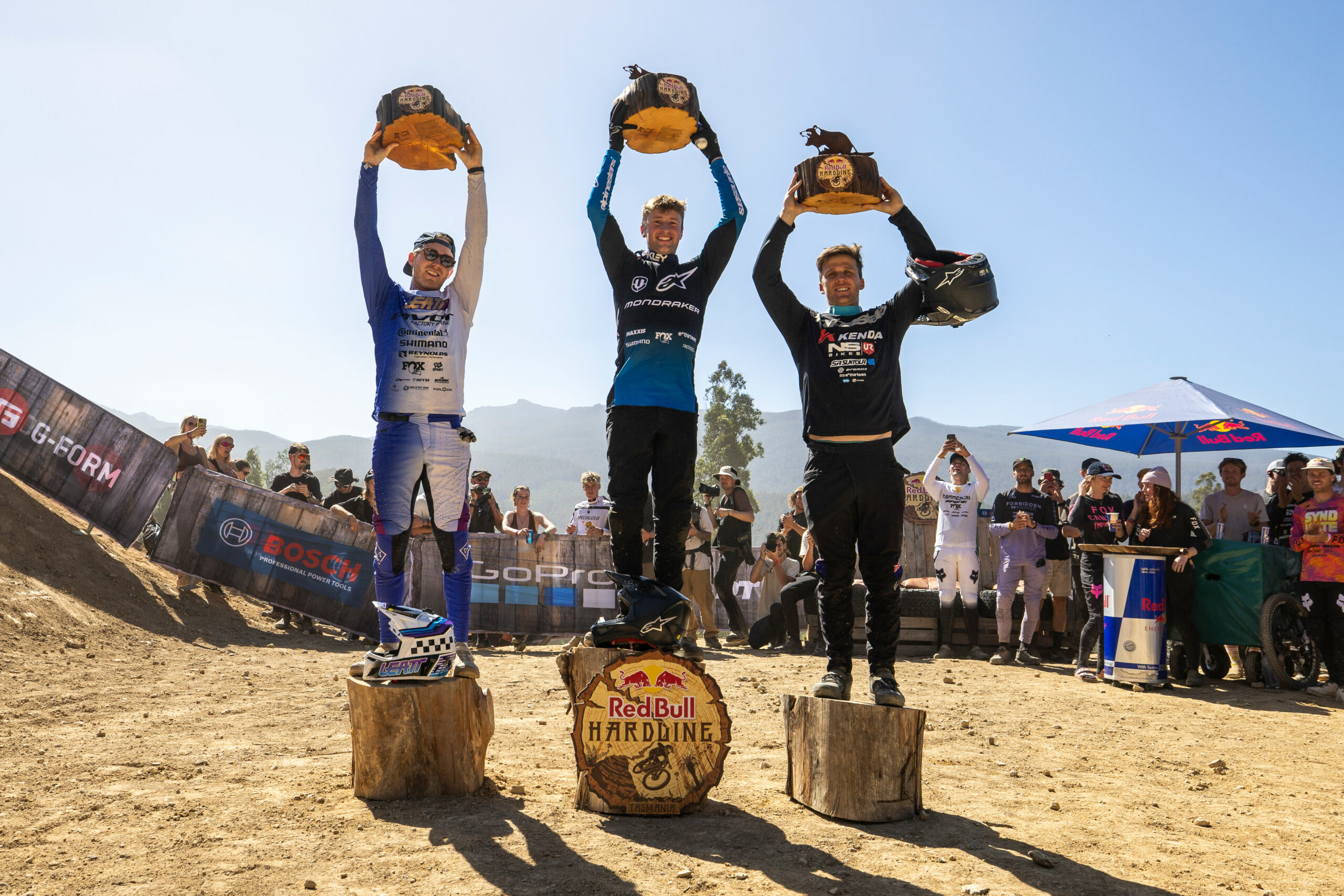 Bernard Kerr, Ronan Dunne, George Brannigan on the podium at Red Bull Hardline in Maydena Bike Park, Australia on February 24, 2024 // Graeme Murray / Red Bull Content Pool // SI202402240016 // Usage for editorial use only //