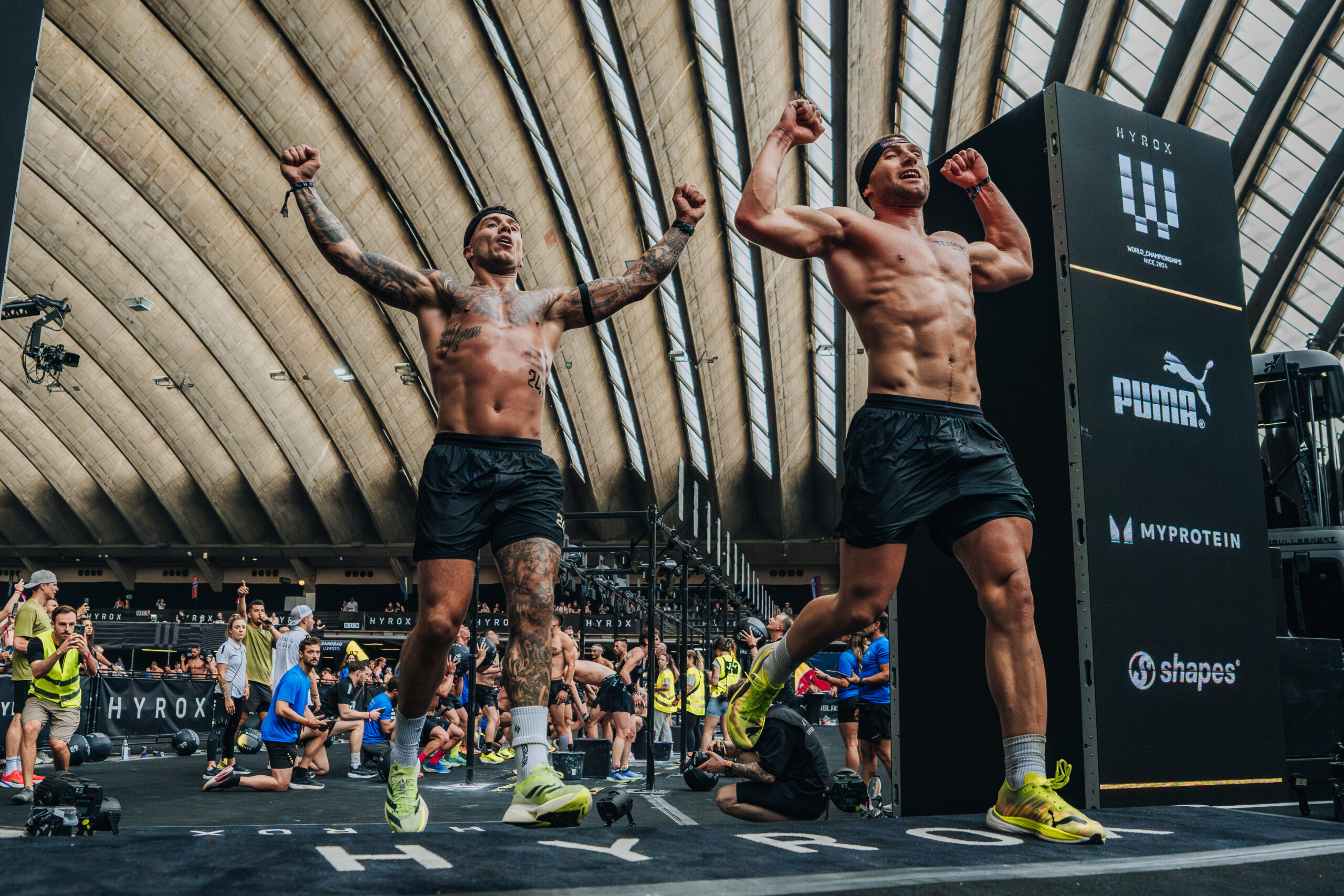 (L-R) Marc Dean & Jake Dearden cross the finish line and take the win in relay category at the Hyrox World Championship in Nice, France, on 9th June 2024. // SI202406100415 // RBMN / HYROX World Championships / 2024 / France // Baptiste Fauchille / Red Bull Content Pool