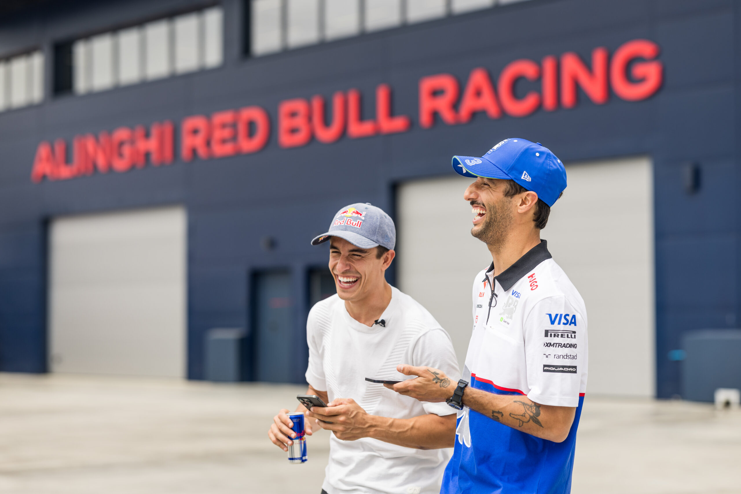 Marc Marquez (L) of Spain and Gresini Racing MotoGP and Daniel Ricciardo (R) of Australia and Visa Cash App RB meet before racing each other in Alinghi Red Bull Racing boats ahead of Spanish F1 weekend in Barcelona, Spain on June 19, 2024.