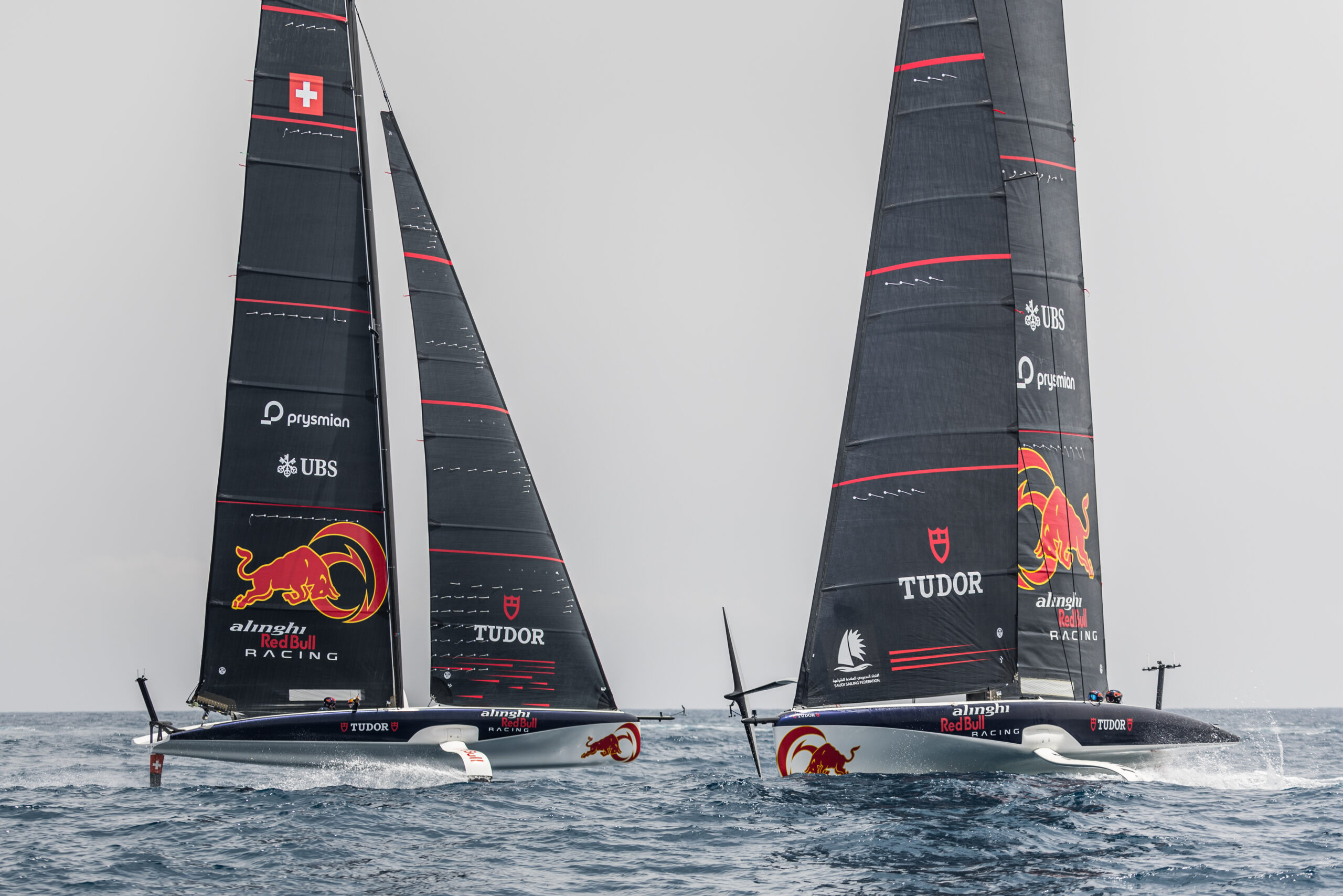 Daniel Ricciardo of Australia and Visa Cash App RB, Marc Marquez of Spain and Gresini Racing MotoGP race each other in Alinghi Red Bull Racing boats ahead of Spanish F1 weekend in Barcelona, Spain on June 19, 2024.