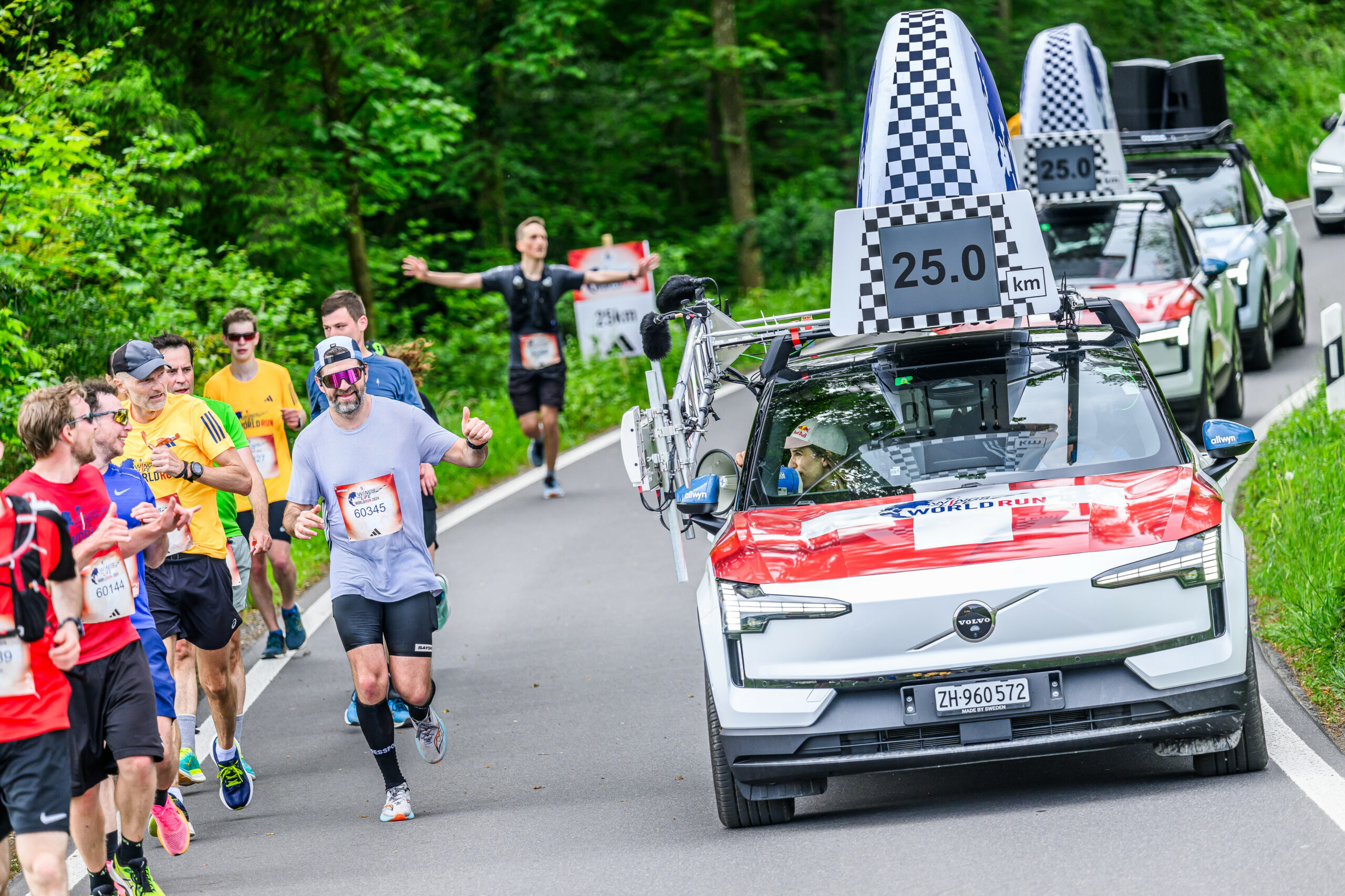 Participants react as Petra Klingler in the catcher car drives by during the Wings for Life World Run Flagship Run in Zug, Switzerland on May 05, 2024. // Romina Amato for Wings for Life World Run // SI202405061229 // Usage for editorial use only //