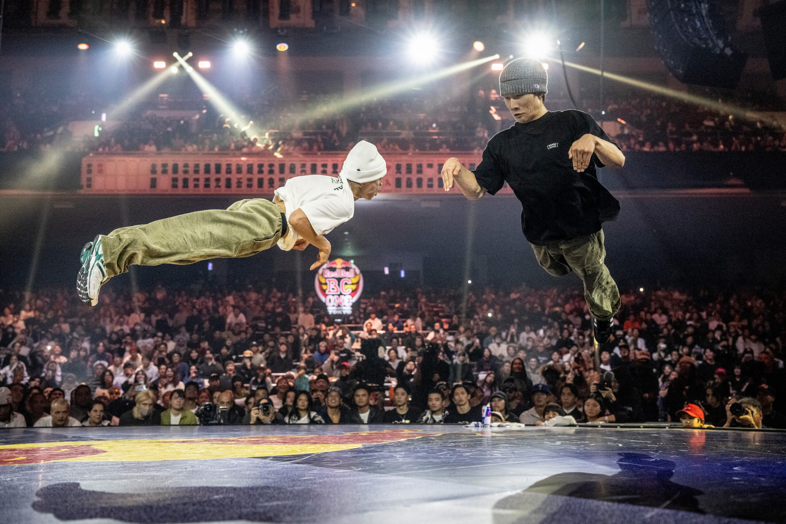 B-boy Issin (L) of Japan competes against Haruto of Japan during the Red Bull BC One World Final at Ryogoku Kokugikan Sumo Arena, Tokyo, Japan on November 9, 2025. // Dean Treml / Red Bull Content Pool // SI202511090322 // Usage for editorial use only //