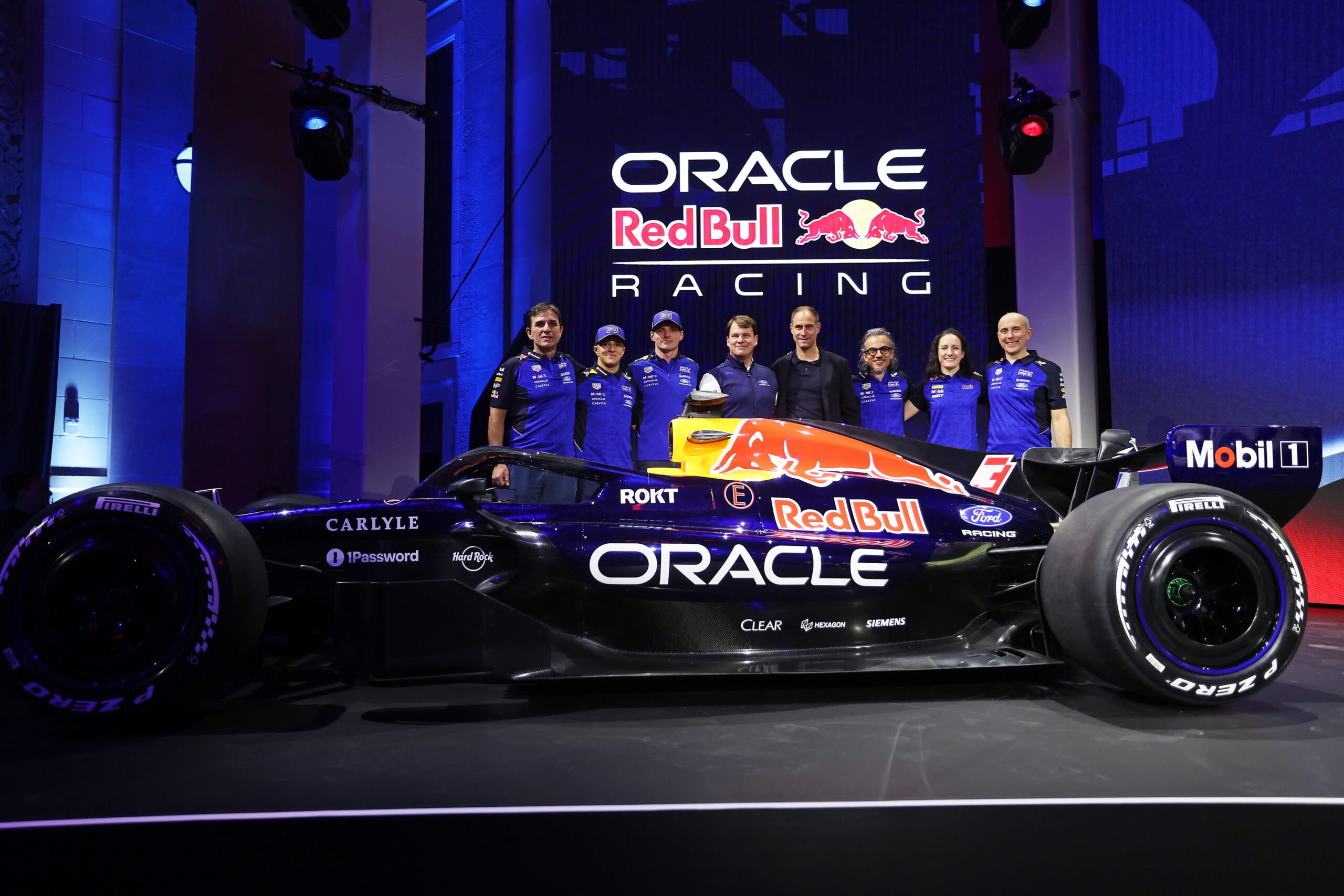DETROIT, MICHIGAN - JANUARY 15: Pierre Wache, Technical Director of Oracle Red Bull Racing, Isack Hadjar of France and Oracle Red Bull Racing, Max Verstappen of the Netherlands and Oracle Red Bull Racing, Jim Farley, CEO of Ford, Oliver Mintzlaff, Managing director of Red Bull GmbH, Laurent Mekies, Team Principal of Oracle Red Bull Racing, Alisha Palmowski, F1 Academy driver for Oracle Red Bull Racing and Phillip Prew, Technical Operations Director unveil their livery on stage during the Red Bull Racing season launch at Michigan Central Station on January 15, 2026 in Detroit, Michigan. (Photo by Mark Thompson/Getty Images) // Getty Images // SI202601160163 // Usage for editorial use only //