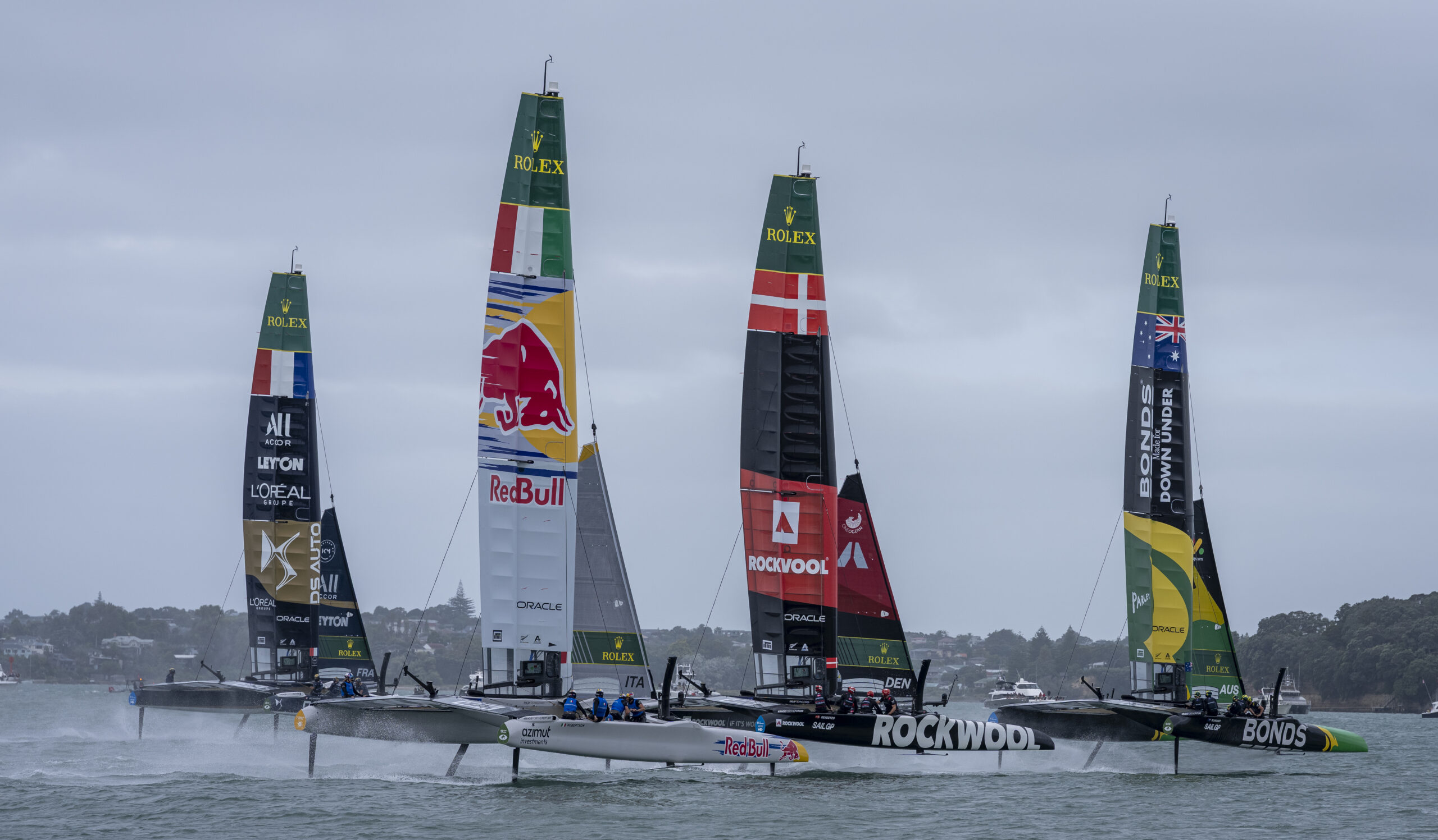 BONDS Flying Roos SailGP Team helmed by Tom Slingsby leads ROCKWOOL Racing SailGP Team helmed by Nicolai Sehested Red Bull Italy SailGP Team helmed by Phil Robertson and DS Automobiles SailGP Team France helmed by Quentin Delapierre in action on Race Day 1 of the ITM New Zealand Sail Grand Prix in Auckland, New Zealand. Saturday 14 February 2026. Rolex SailGP Championship Event 2 2026 Season. Photo: Jason Ludlow for SailGP. Handout image supplied by SailGP