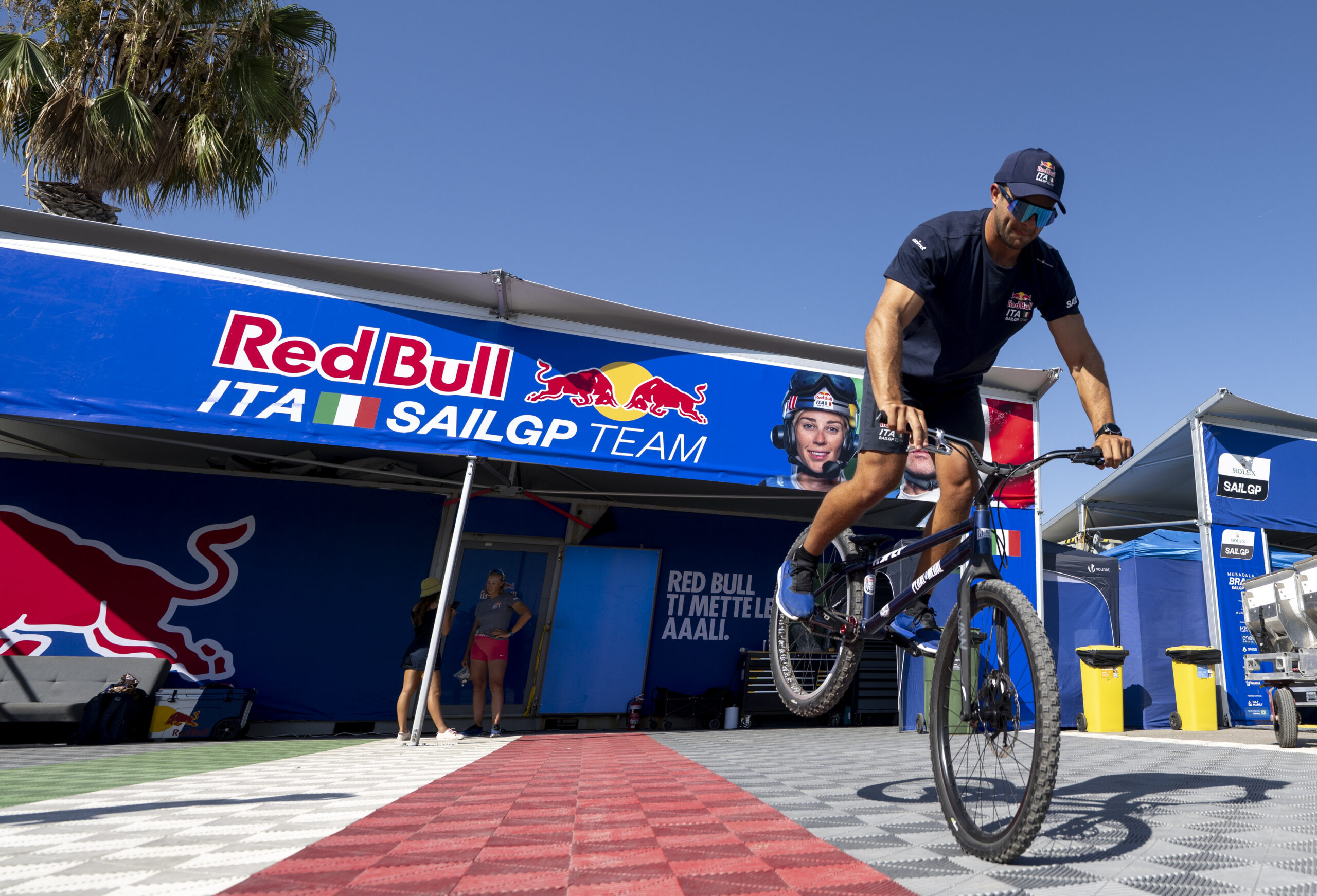 A member of the Red Bull Italy SailGP shore team tries out BMX tricks outside the Red Bull Italy SailGP Team hangar in the technical area ahead of the Spain Sail Grand Prix in Valencia, Spain. Friday 4 September 2026. Rolex SailGP Championship Event 10 2026 Season. Photo: Ricardo Pinto for SailGP. Handout image supplied by SailGP