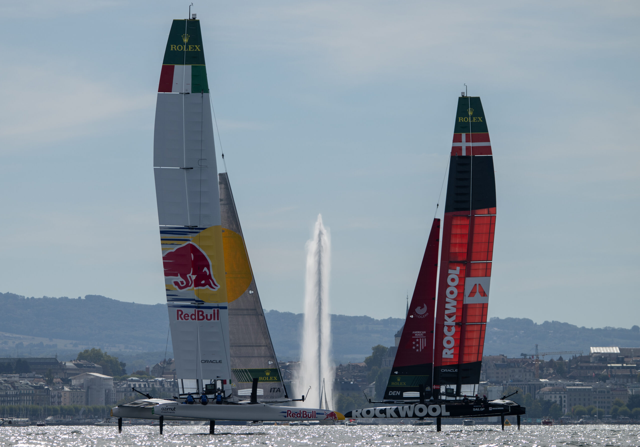 Red Bull Italy SailGP Team driven by Phil Robertson and ROCKWOOL Racing SailGP Team driven by Nicolai Sehested race past the Jet d'Eau on Race Day 2 of the Switzerland Sail Grand Prix in Geneva, Switzerland. Sunday 20 September 2026. Rolex SailGP Championship Event 11 2026 Season. Photo: Ricardo Pinto for SailGP. Handout image supplied by SailGP