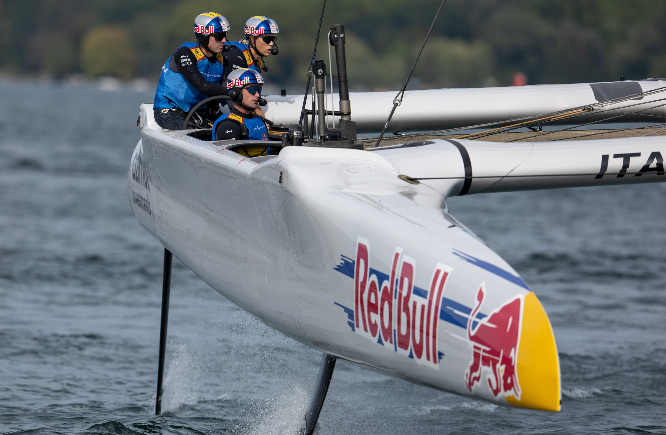Phil Robertson, driver of Red Bull Italy SailGP Team, Jana Germani, strategist of Red Bull Italy SailGP Team, and Andrea Tesei, flight controller of Red Bull Italy SailGP Team, in action on Race Day 2 of the Switzerland Sail Grand Prix in Geneva, Switzerland. Sunday 20 September 2026. Rolex SailGP Championship Event 11 2026 Season. Photo: Jonathan Nackstrand for SailGP. Handout image supplied by SailGP
